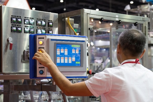 Worker at an Industrial Control Panel